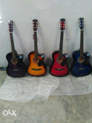 Beige, Black, And Brown Guitars