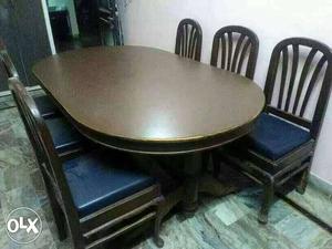 Dark brown teek wooden dinning table