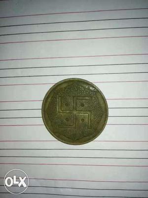 Golden colored very old coin