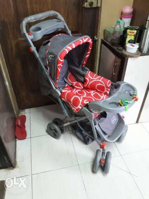 Gray And Red Pram Stroller