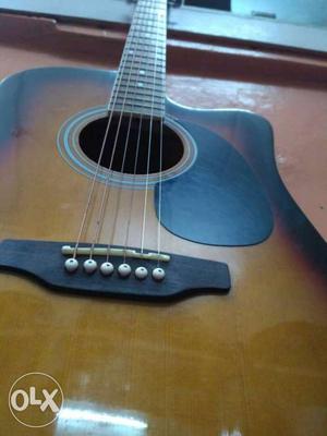 Original Pluto Jumbo Acoustic Guitar with an excellent