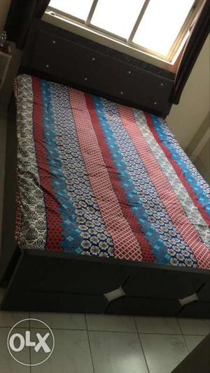 Red, Blue, And White Floral Bed Cover