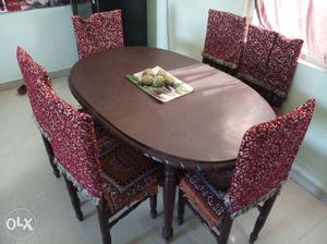 Round Brown Wooden Table With Six Chairs