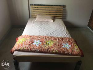 Single wooden bed without mattress - 2 years old