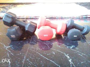 Three Pairs Of Black And Red Dumbbells