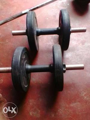 Two Black And Silver Dumbbells