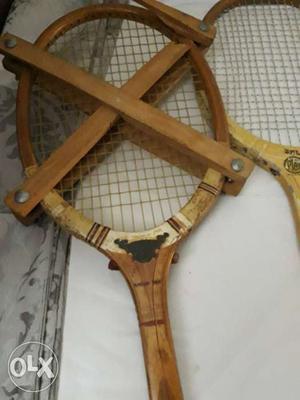 Two Brown Wooden Framed Badminton Rackets