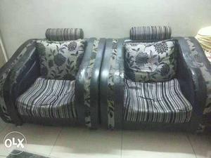 Two Gray Floral Sofa Chairs