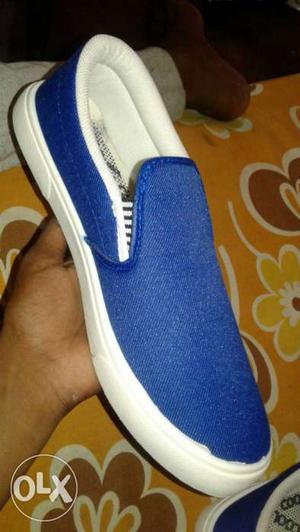 Unpaired Blue And White Slip-ons