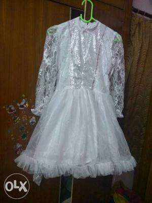 White, pink and purple frock for 7 to 9 year kids.