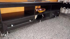 It's a perfect black wooden TV stand.