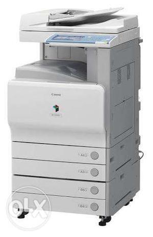 White And Blue Canon Photocopying Machine