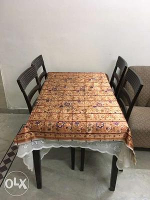 Wooden Dinning table with 4 chairs good condition