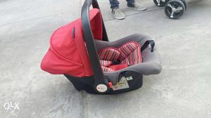 Baby's Red And Black Car Seat Carrier