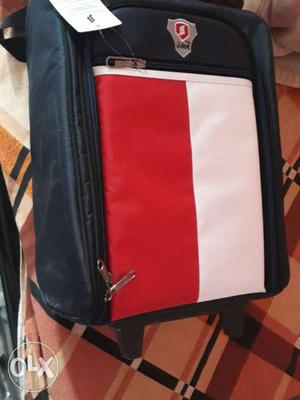 Brand new Black, Red, And White luggage bag / trolley with