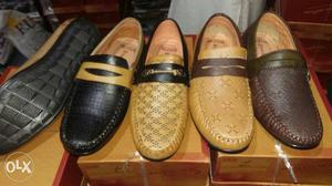 Four Unpaired Loafer Shoes