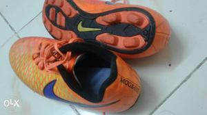 Pair Of Orange-and-black Nike Cleats