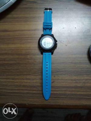 Round Black Digital Watch With Blue Band