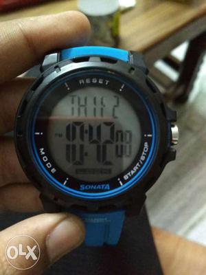 Round Black Digital Watch With Blue Strap