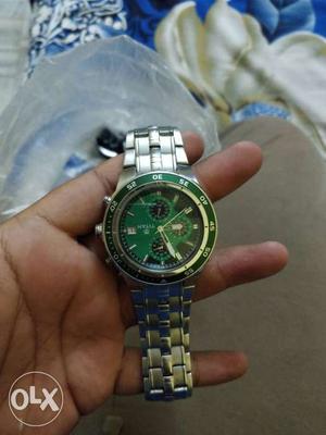 Round Green And Silver-colored Chronograph Watch