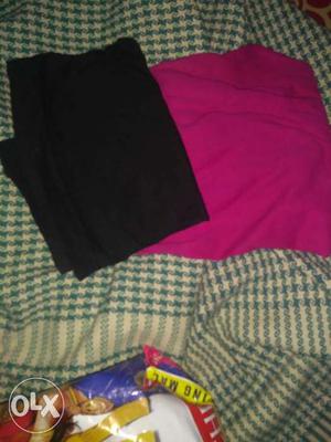 Two Black And Pink Textiles