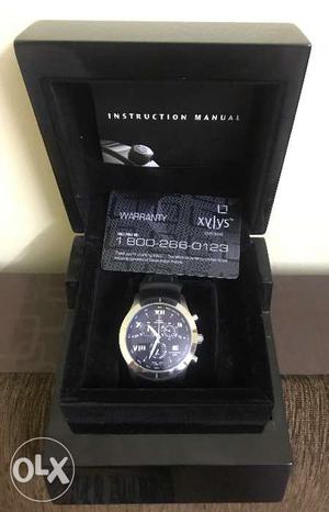 Xylys watch with warrenty card and box very