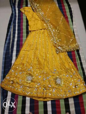 Yellow net lahega beautiful work worn only once