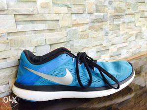 paired Blue And White Nike Running Shoe