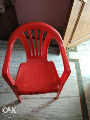 A plastic chair with a plastic stool.Comfortable, Spacious,