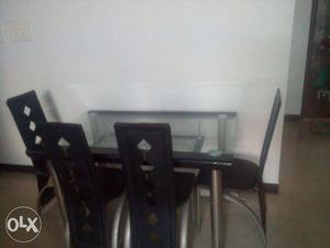 A table with 4 chairs at 