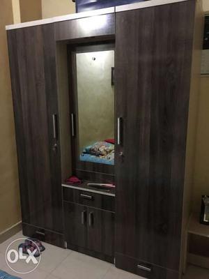 Brown And Black Wooden Cabinet With Mirror