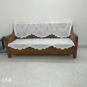 Brown Leather Padded Sofa With White Floral Mesh Cloths