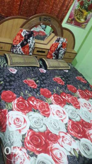 Brown Wooden Bed Frame With Black And Red Floral Bed Set