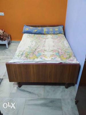 Brown take Wooden Bed