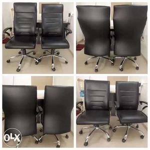 Four Black High Back Revolving Office Chairs