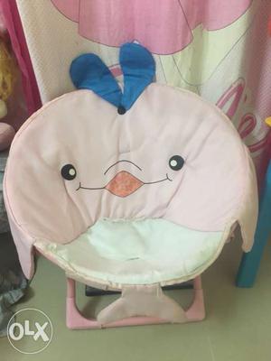 It is a baby sitting Chair Nice looking baby love