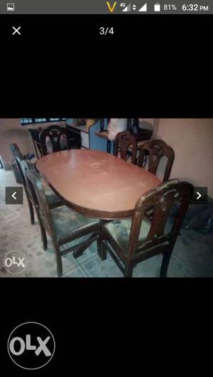 Oval Brown Wooden Top Table With Six Chair Set Screenshot