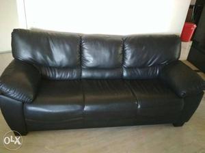 Three seater two sets of black leather sofa..