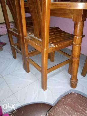 Two Brown Wooden Chairs And Dinning Table
