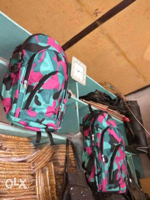 Two Pink And Teal Backpacks