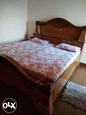 Urgently sell brown bed with mattresses