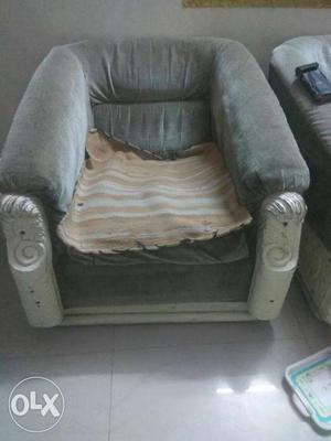 White Wooden Base Gray Padded Armchair