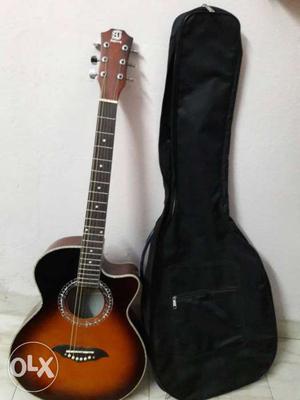 Black And Brown Acoustic Guitar With Gig Bag
