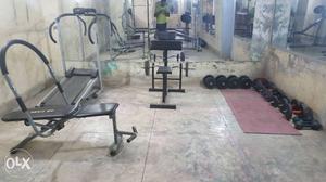 Black Bench Press And Treadmill