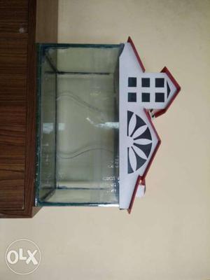Fish Tank with white and red cover. Price Negotiable