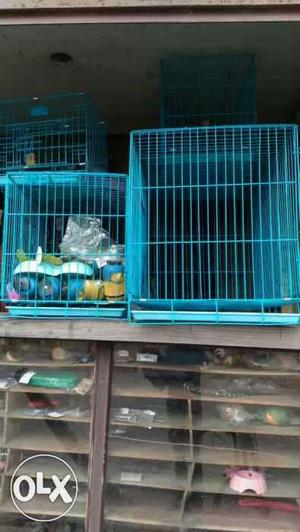 Four Blue Collapsible Pet Cages