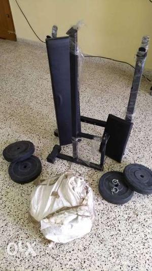 It has an unused exercise bench with arms 25 kgs