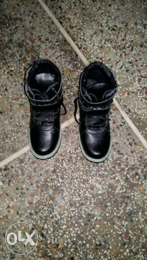 Pair Of Black Leather Velcro Shoes
