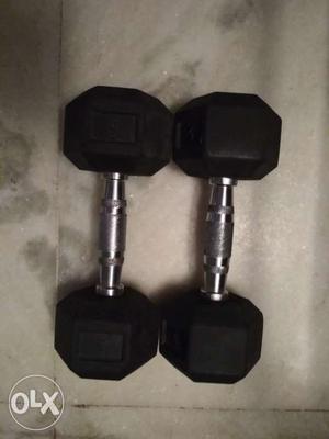 Pair of 5 kg dumbbells. Rubber weights and steel