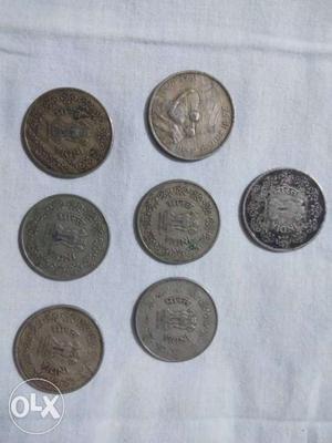 Seven Several Silver-colored Coins
